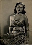 Barbara, aged 16, in a strapless, pale blue brocade evening gown