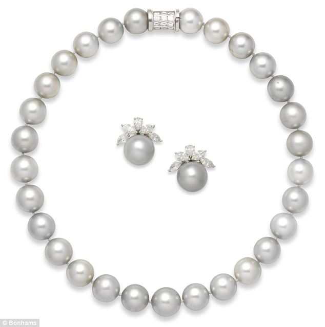 A grey cultured pearl necklace and pair of earclips by David Morris. Estimated worth: £20,000 – £25,000