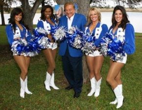 Bob Bradford is perfectly color coordinated as he raises the pompoms with the Cowboys Cheerleaders