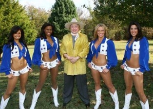 Barbara Taylor Bradford poses with the Dallas Cowboys Cheerleader Squad at the Lupton Ranch in Dallas, Texas