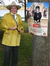 Wanted Dead Or Alive? Barbara Taylor Bradford poses with her Dallas event poster at the Lupton Ranch in Dallas, Texas