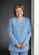 Barbara Taylor Bradford wearing pale blue trouser suit