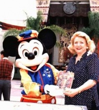 Barbara Taylor Bradford promoting her novel Everything to Gain with Mickey Mouse at Walt Disney World