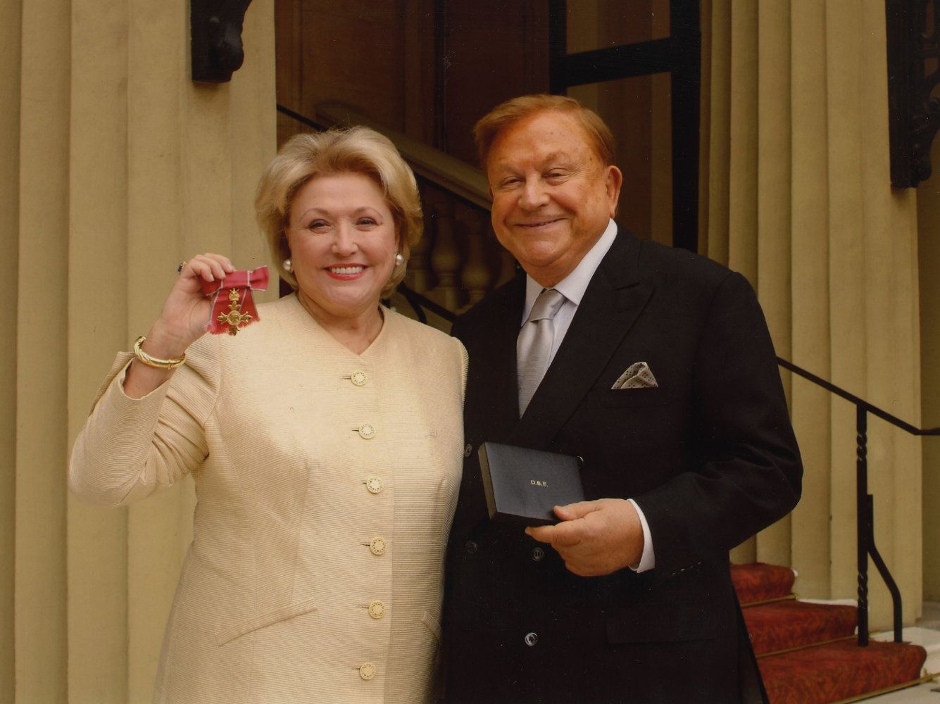 Robert Bradford pictured with Barbara Taylor Bradford after she received her OBE, Buckingham Palace